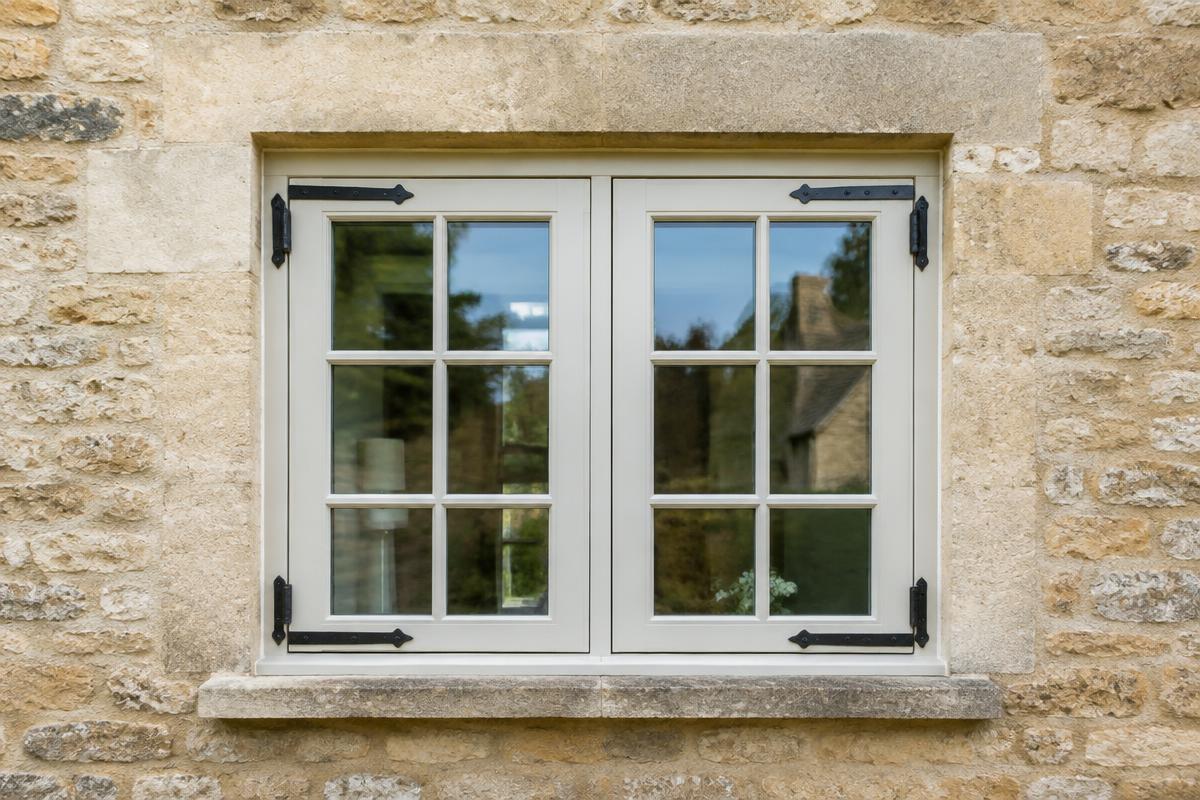 Traditional painted timber casement cottage window in a Bath stone cottage in Larkhall after repair